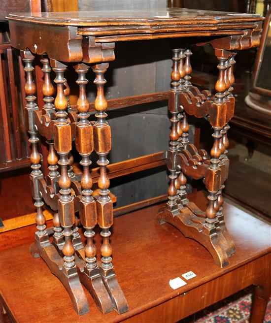 A nest of three walnut tea tables